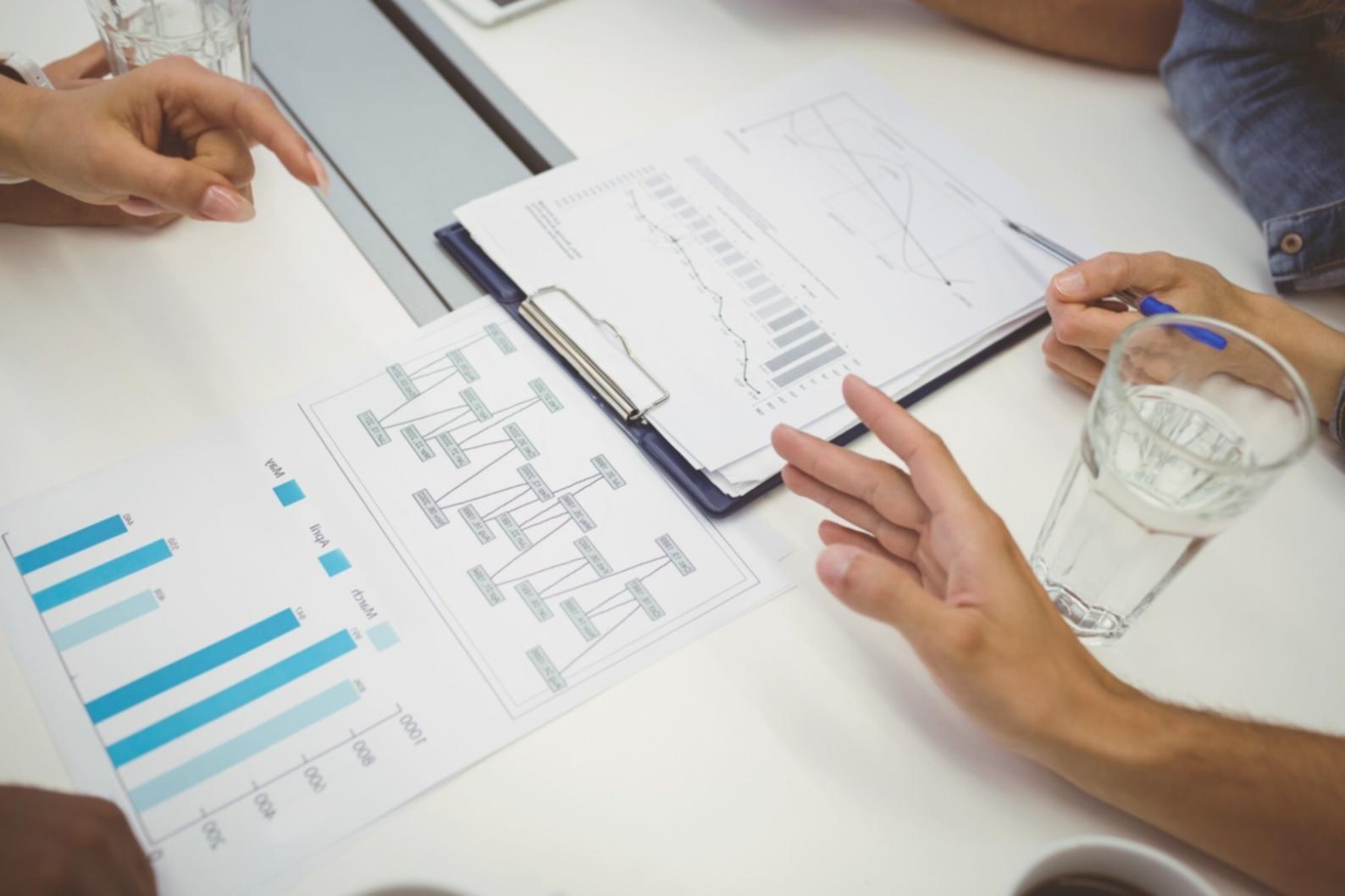 SEO professional reviewing analytics dashboard with keyword rankings and traffic patterns