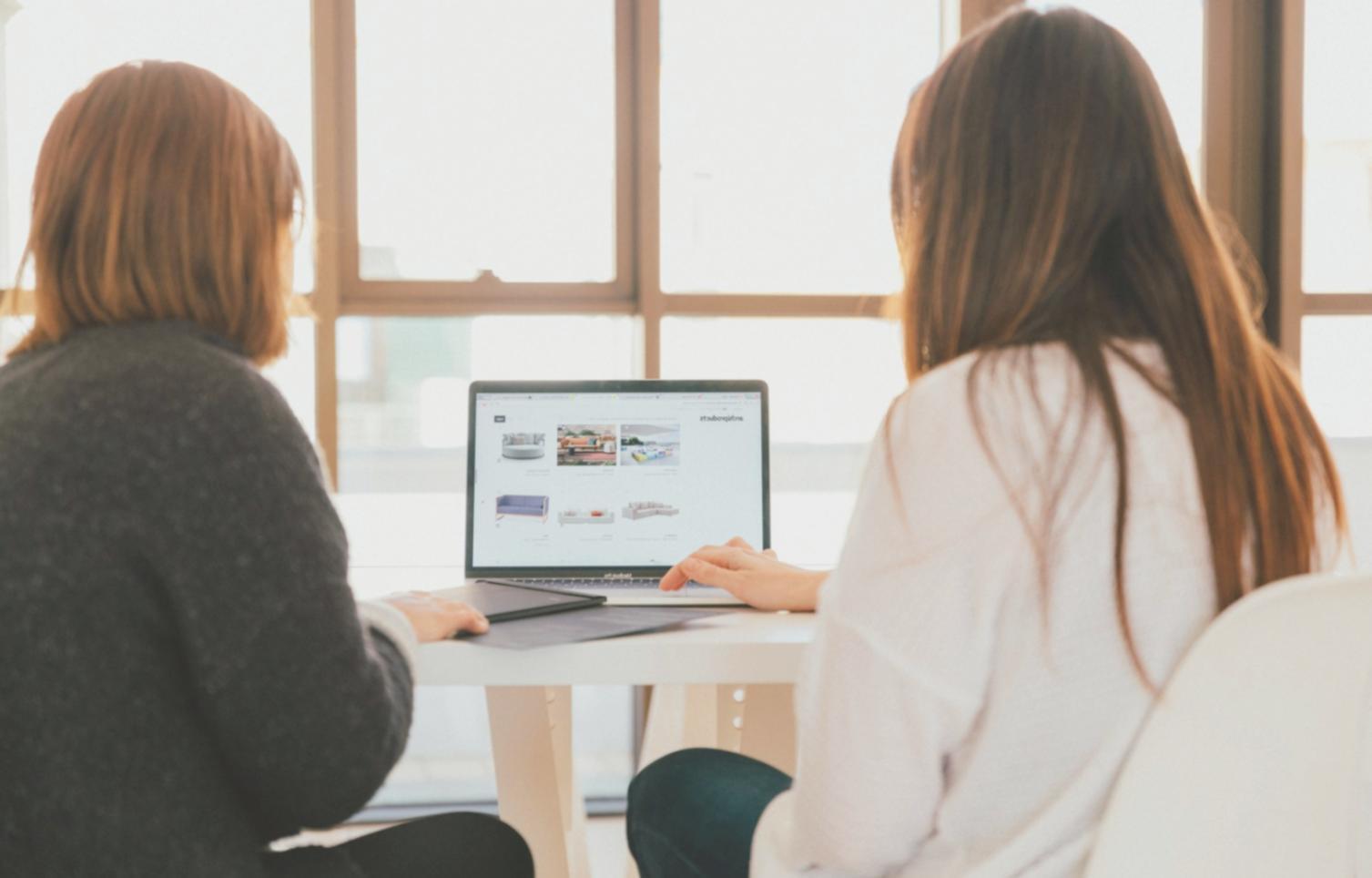 Students working on laptops during collaborative SEO workshop session